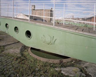 Detail showing cast-iron 'Dundee Harbour' crest on footbridge