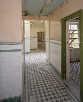Interior. Ground floor, tiled corridor leading to kitchen