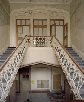 Interior. Main staircase, view from half landing to N