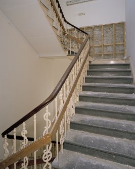 Interior. 2nd floor, back stair, view from W