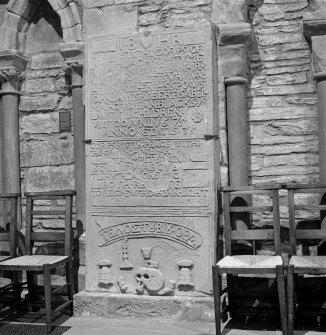 Interior.  Nave, view of carved grave slab