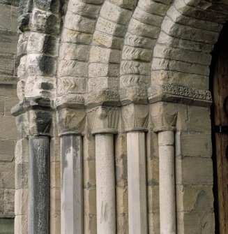 West doorway, view of capitals on N side of doorway