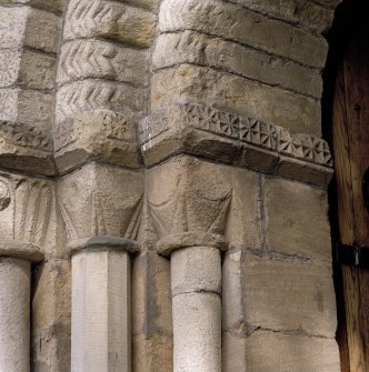 West doorway, detail of capitals on N side of doorway