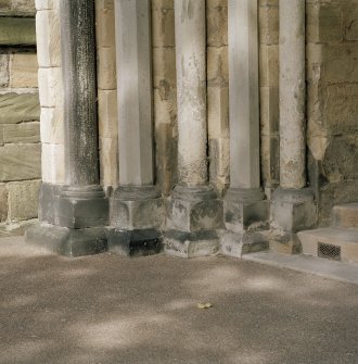 West doorway, detail of column bases on N side of doorway