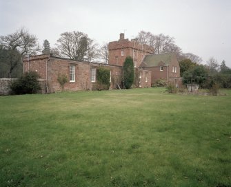 View of 19th century single storey wing and tower from SW