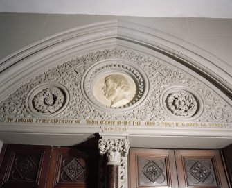 Interior. W lobby, detail of tympanum with portrait  medallion of Rev John Eadie by John Mossman 1876