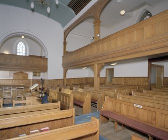 Interior. View from E showing galleries and pews