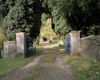View of entrance piers and driveway.