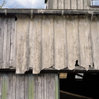 Detail of asbestos wall cladding on boathouse.