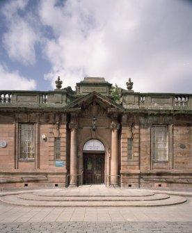 Detail of main entrance with "ERECTED MCMIV" above pediment and "PUBLIC LIBRARY" below from ESE
