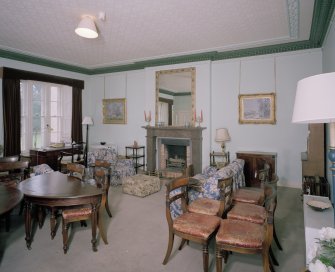 Interior. First floor. Drawing room showing fireplace (dining table and chairs not originally in the room)