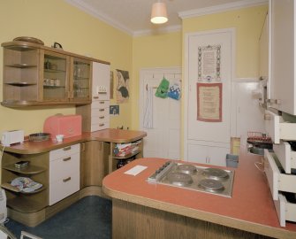 Interior. First floor. Private or family kitchen with 1970's units