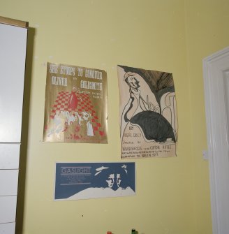 Interior. First floor. Private or family kitchen. Detail of theatrical posters