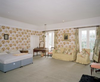Interior.  Second floor. Principal guest bedroom with dramatic floral wallpaper.