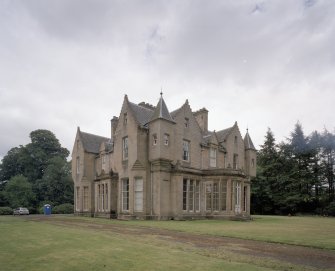 View from NW showing bowed conservatory at centre