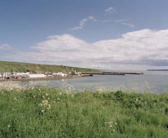 General view of harbour with lighthouse is distance, from SW