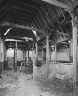 Interior. View of main byre showing roof structure and stalls