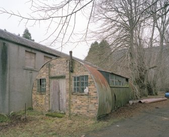 Garages/Workshops and nissen hut. View from ESE