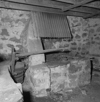 Smithy. Interior. Detail of hearth and bellows