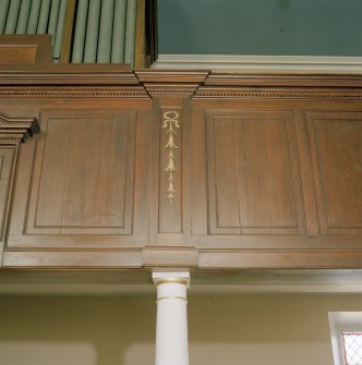 Interior. Detail of panelled gallery front with gilt decoration