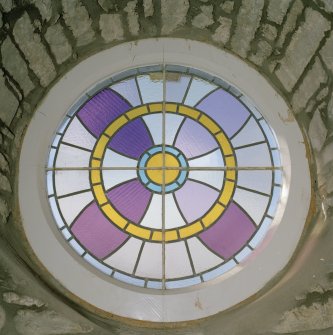 Interior. Detail of circular leaded light window