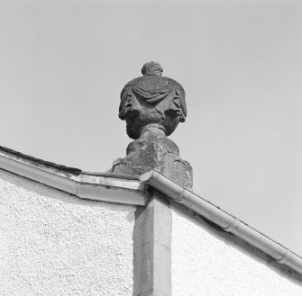 Detail of decorative swagged urn at skewputt