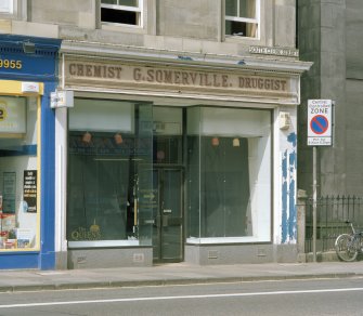 View of "Chemist G. Somerville. Druggist" shopfront from ESE