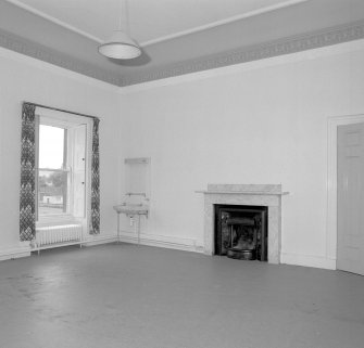 Interior. First floor View of a bedroom showing marble fireplace