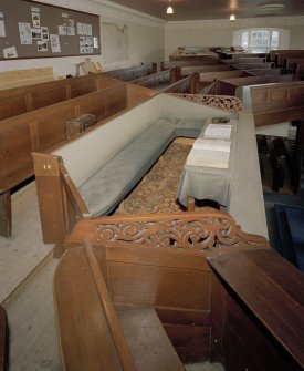 Laird's pew in gallery with padded seats and bibles