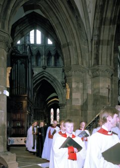 Interior.
View of aisle showing director of music, verger and chaplain at tail of choristers' procession.