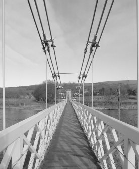 View across deck of bridge showing suspension from S