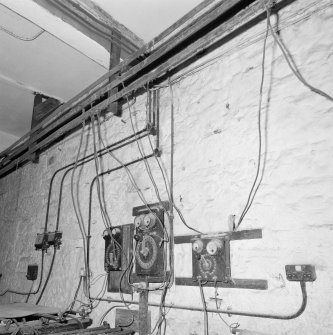 Interior. Lower ground floor. Workshop. Detail of control switches and overhead busbar