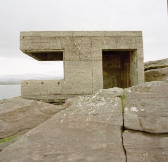 View from NW of searchlight emplacement showing entrance and foundation on bedrock