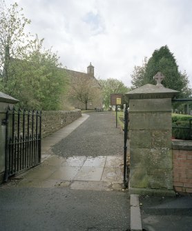 View from NE showing entrance gates and main approach