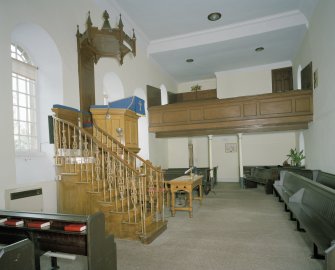 Interior, view from E showing pulpit and E gallery
