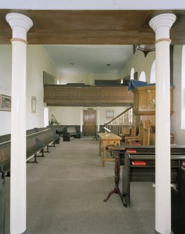 Interior, view from W showing W gallery columns, pulpit and E gallery