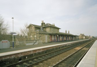 View of N-bound platform and station offices from SE