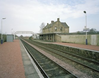 General view from W, showing both platforms, the footbridge, and the station house and offices