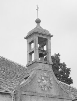 Birdcage bellcote, with clock and 1804 datestone