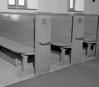 Interior, detail of roll topped pews