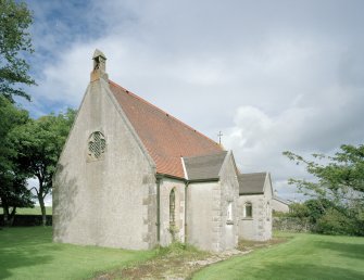 View from SW showing bellcote and projecting S porch and organ chamber