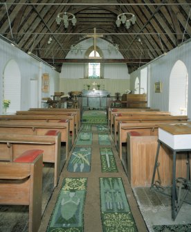 Interior. View from W to chancel showing carpet designed by R H H Montgomery