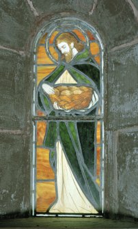 Interior, detail of stained glass window depicting the communion bread