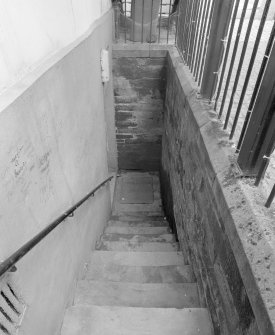 Stair to basement on south wall, view looking down