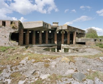 View from SE showing gun-pit of S emplacement and concrete canopy with brickwork below.