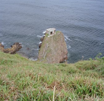 General view from SW over cliffs to searchlight emplacement on rock stack.  Also visible are sections of timber access steps.