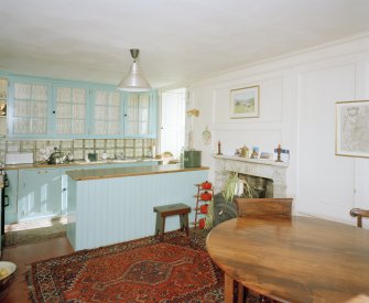 Interior.
Kitchen, general view, showing cabinets from The Peel, Peebleshire and 18th century fireplace.