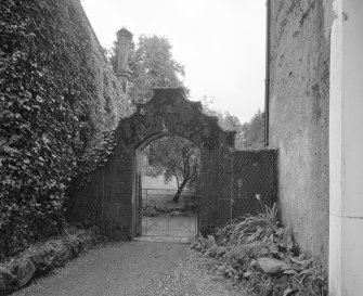 Detail of archway and gate between house and stable block