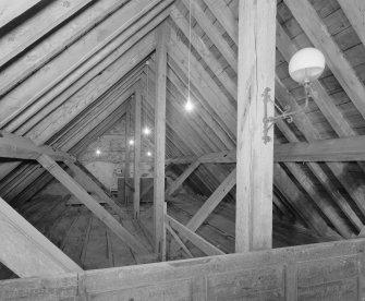 Interior.
View of king post roof structure including gas light fitting.