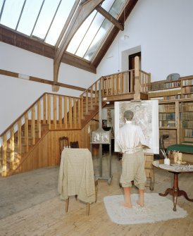 Interior, view of studio from West Interior, showing bookcases, entrance staircase and manequin representing Hornel at work